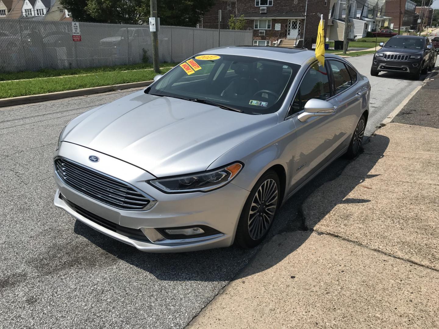 2017 Silver /Gray Ford Fusion Hybrid Titanium (3FA6P0RU4HR) with an 2.0L L4 DOHC 16V HYBRID engine, CVT transmission, located at 577 Chester Pike, Prospect Park, PA, 19076, (610) 237-1015, 39.886154, -75.302338 - 2017 Ford Fusion Titanium Hybrid: Sunroof, backup camera, new PA inspection, great on gas, SUPER CLEAN, runs LIKE NEW! This vehicle comes inspected and has been given a bumper to bumper safety check. It is very clean, reliable, and well maintained. We offer a unique pay plan that is known for bei- Photo#3