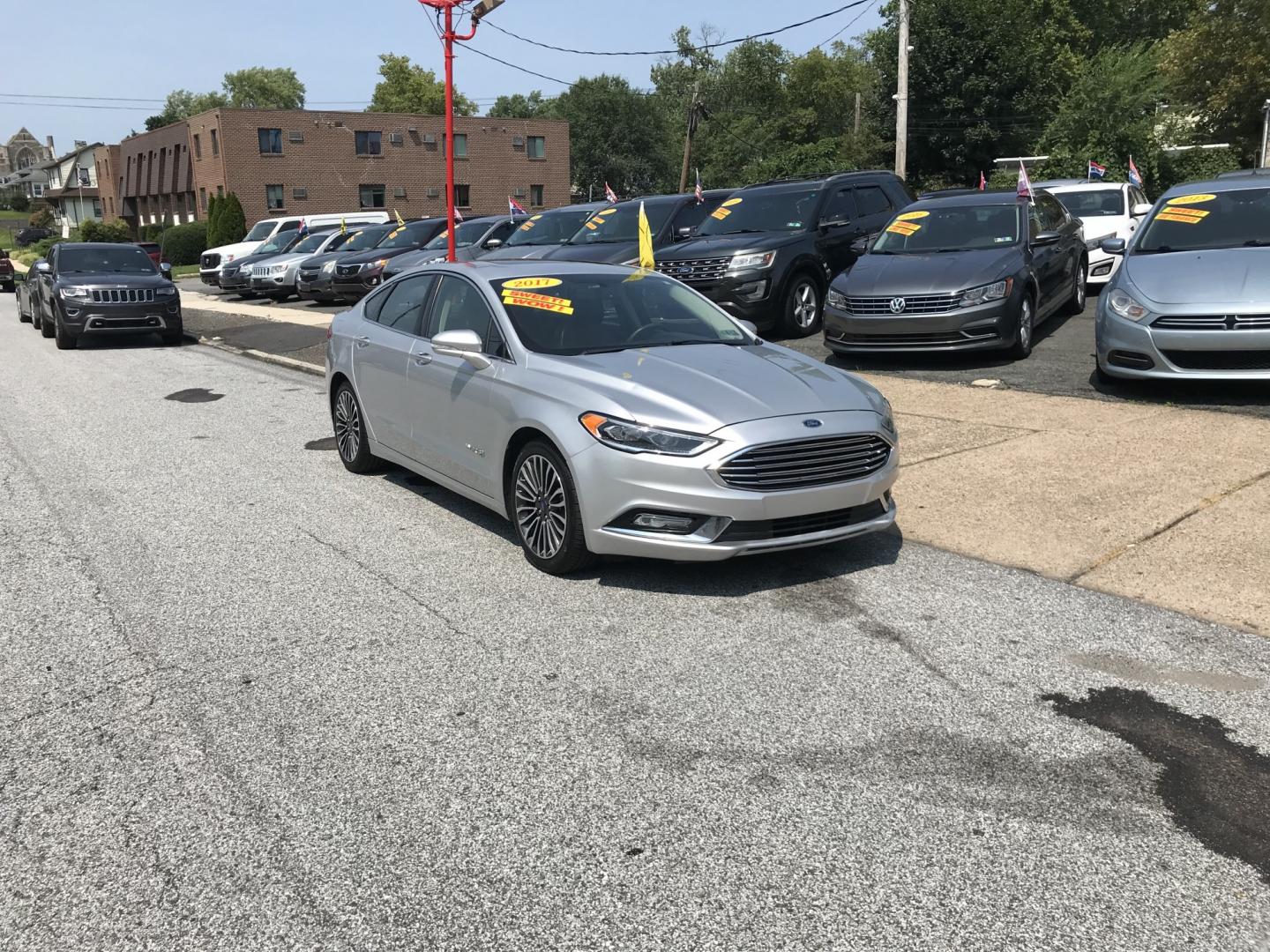 2017 Silver /Gray Ford Fusion Hybrid Titanium (3FA6P0RU4HR) with an 2.0L L4 DOHC 16V HYBRID engine, CVT transmission, located at 577 Chester Pike, Prospect Park, PA, 19076, (610) 237-1015, 39.886154, -75.302338 - 2017 Ford Fusion Titanium Hybrid: Sunroof, backup camera, new PA inspection, great on gas, SUPER CLEAN, runs LIKE NEW! This vehicle comes inspected and has been given a bumper to bumper safety check. It is very clean, reliable, and well maintained. We offer a unique pay plan that is known for bei- Photo#1