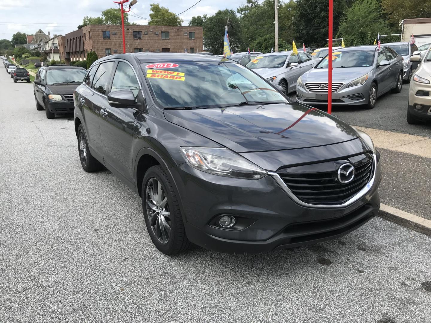 2014 Gray /Black Mazda CX-9 Grand Touring AWD (JM3TB3DVXE0) with an 3.7L V6 DOHC 24V engine, 6A transmission, located at 577 Chester Pike, Prospect Park, PA, 19076, (610) 237-1015, 39.886154, -75.302338 - 2014 Mazda CX-9 Grand Touring: Sunroof, 3rd row seating, backup camera, new PA inspection, SUPER CLEAN, runs LIKE NEW! This vehicle comes inspected and has been given a bumper to bumper safety check. It is very clean, reliable, and well maintained. We offer a unique pay plan that is known for bei- Photo#2