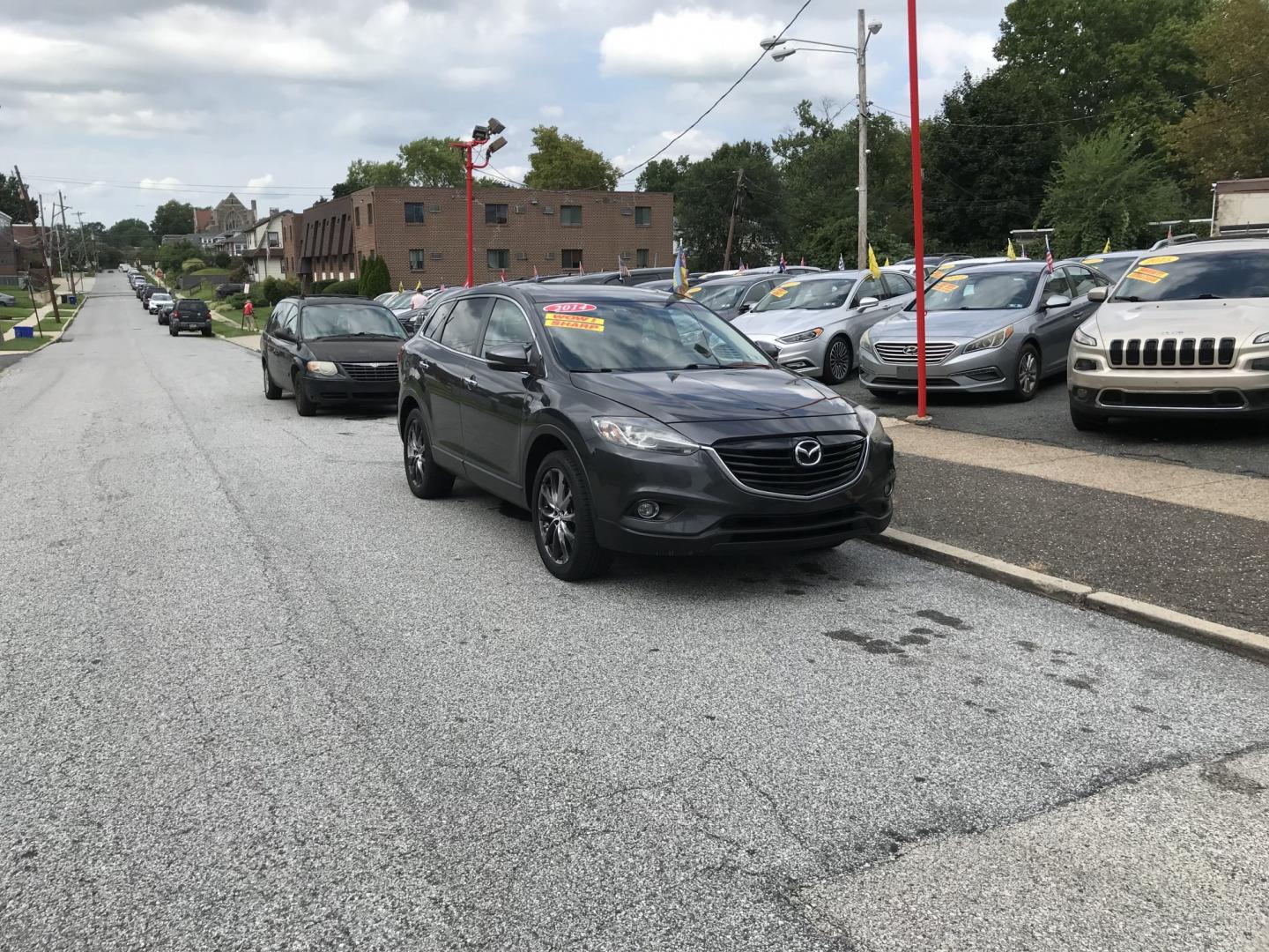 2014 Gray /Black Mazda CX-9 Grand Touring AWD (JM3TB3DVXE0) with an 3.7L V6 DOHC 24V engine, 6A transmission, located at 577 Chester Pike, Prospect Park, PA, 19076, (610) 237-1015, 39.886154, -75.302338 - 2014 Mazda CX-9 Grand Touring: Sunroof, 3rd row seating, backup camera, new PA inspection, SUPER CLEAN, runs LIKE NEW! This vehicle comes inspected and has been given a bumper to bumper safety check. It is very clean, reliable, and well maintained. We offer a unique pay plan that is known for bei- Photo#1
