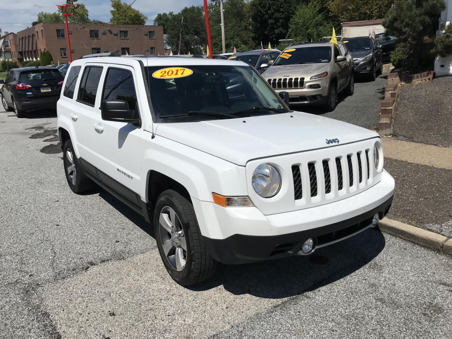 2017 White /Black Jeep Patriot Latitude 4WD (1C4NJRFB7HD) with an 2.4L L4 DOHC 16V engine, Automatic transmission, located at 577 Chester Pike, Prospect Park, PA, 19076, (610) 237-1015, 39.886154, -75.302338 - 2017 Jeep Patriot Latitude: Only 121k miles, sunroof, 4x4, new PA inspection, SUPER CLEAN, runs LIKE NEW! This vehicle comes inspected and has been given a bumper to bumper safety check. It is very clean, reliable, and well maintained. We offer a unique pay plan that is known for being the easies- Photo#2