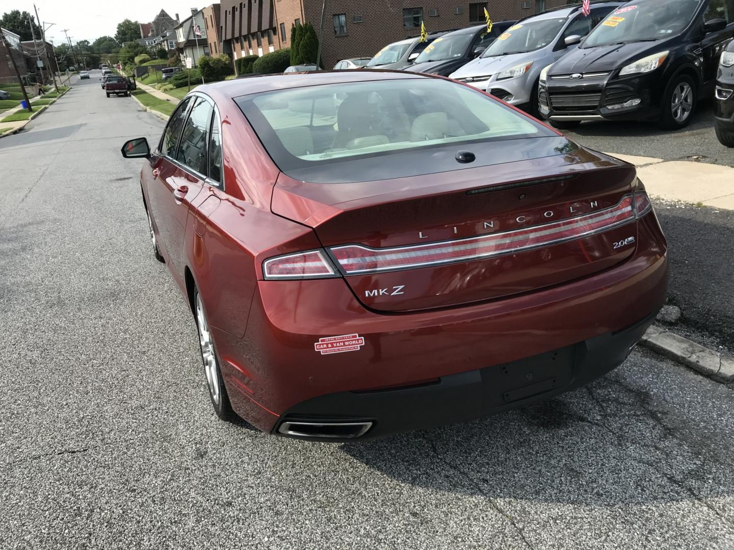 2014 Red /Beige Lincoln MKZ AWD (3LN6L2J9XER) with an 2.0L L4 DOHC 16V engine, 6-Speed Automatic transmission, located at 577 Chester Pike, Prospect Park, PA, 19076, (610) 237-1015, 39.886154, -75.302338 - 2014 Lincoln MKZ: AWD, navigation system, backup camera, sunroof, new PA inspection, SUPER CLEAN, runs LIKE NEW! This vehicle comes inspected and has been given a bumper to bumper safety check. It is very clean, reliable, and well maintained. We offer a unique pay plan that is known for being the- Photo#5