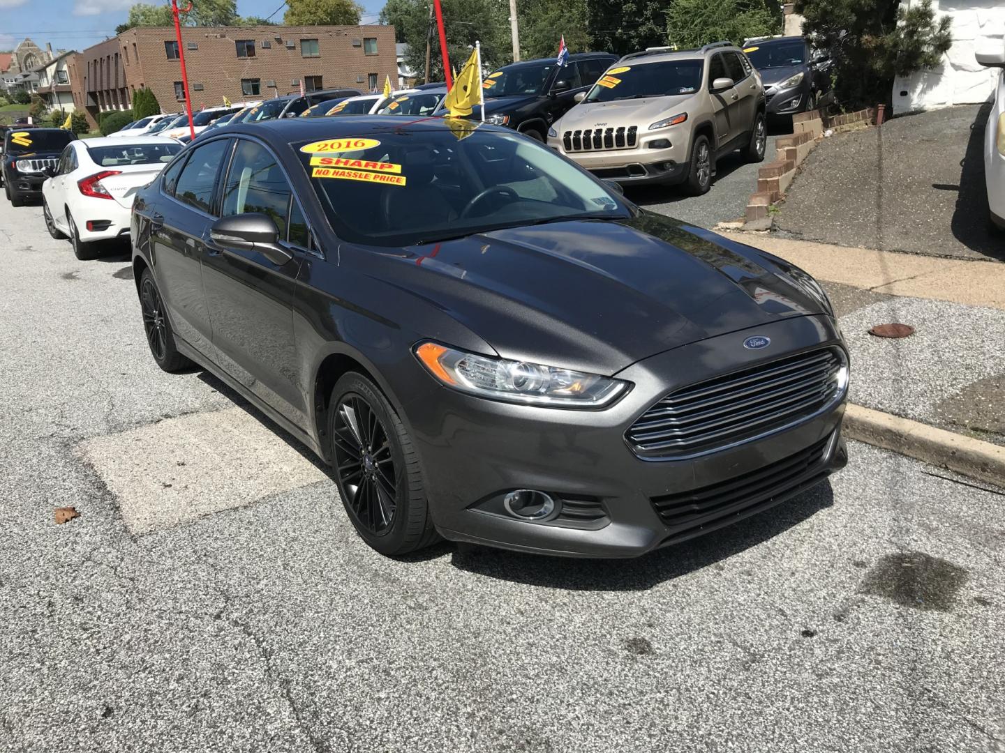 2016 Gray /Black Ford Fusion SE AWD (3FA6P0T90GR) with an 2.0L L4 DOHC 16V engine, 6A transmission, located at 577 Chester Pike, Prospect Park, PA, 19076, (610) 237-1015, 39.886154, -75.302338 - 2016 Ford Fusion SE AWD: Navigation system, remote start, backup camera, sunroof, new PA inspection, SUPER CLEAN, runs LIKE NEW! This vehicle comes inspected and has been given a bumper to bumper safety check. It is very clean, reliable, and well maintained. We offer a unique pay plan that is kno- Photo#2