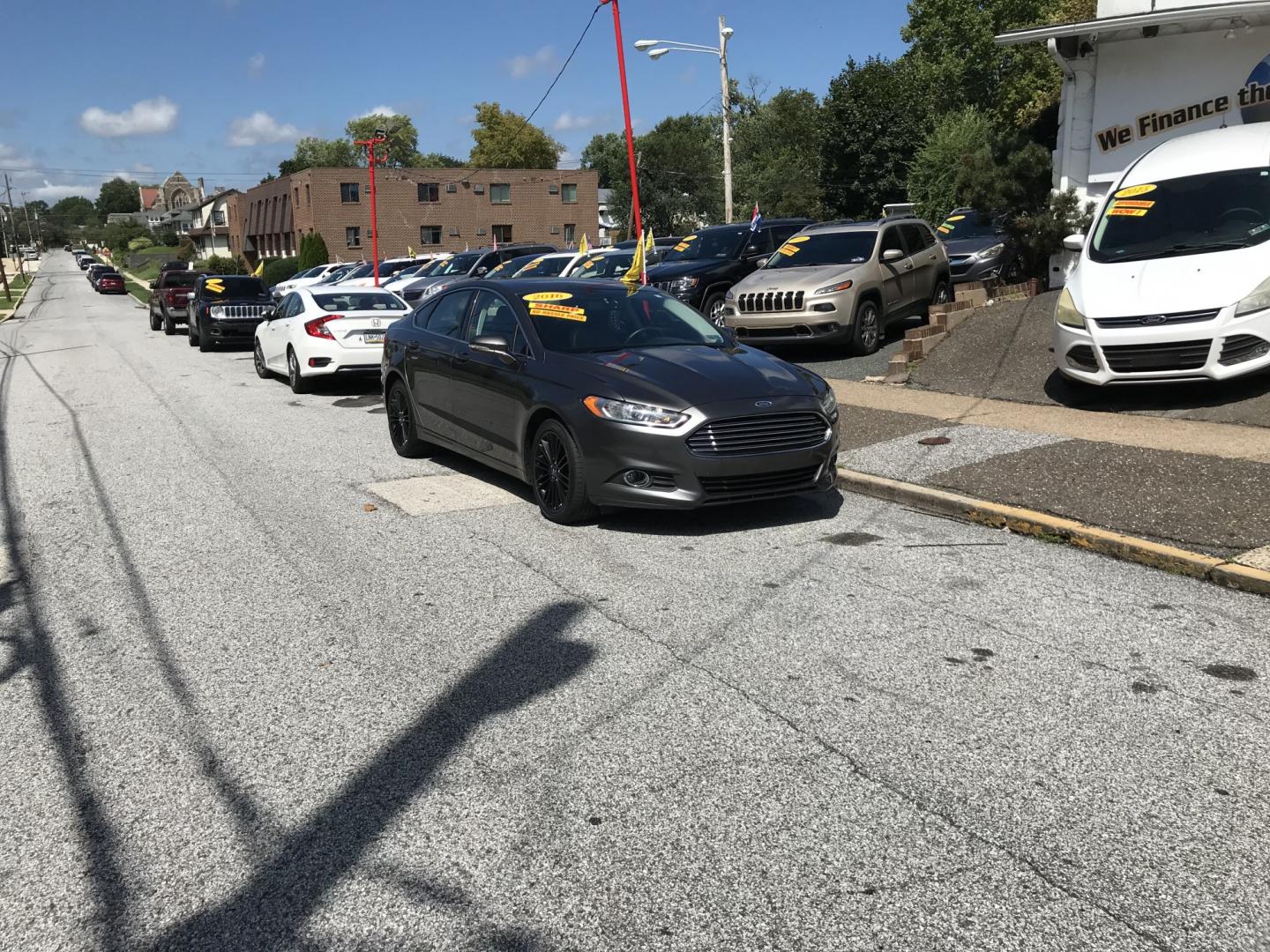 2016 Gray /Black Ford Fusion SE AWD (3FA6P0T90GR) with an 2.0L L4 DOHC 16V engine, 6A transmission, located at 577 Chester Pike, Prospect Park, PA, 19076, (610) 237-1015, 39.886154, -75.302338 - 2016 Ford Fusion SE AWD: Navigation system, remote start, backup camera, sunroof, new PA inspection, SUPER CLEAN, runs LIKE NEW! This vehicle comes inspected and has been given a bumper to bumper safety check. It is very clean, reliable, and well maintained. We offer a unique pay plan that is kno- Photo#1