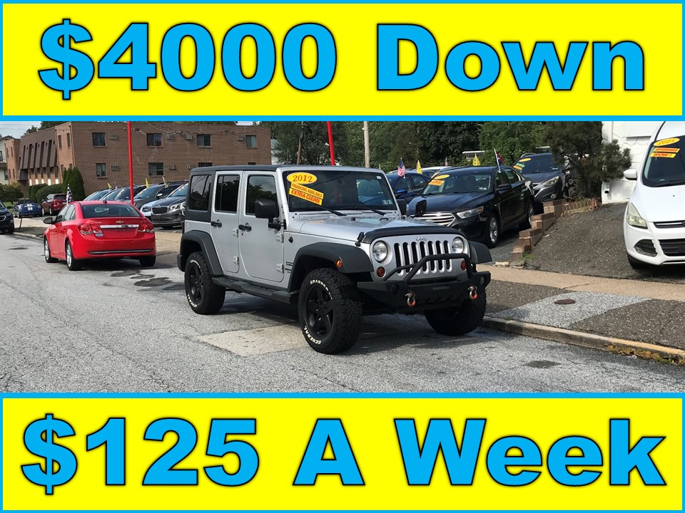 photo of 2012 Jeep Wrangler Unlimited Sport 4WD (Stick Shift)