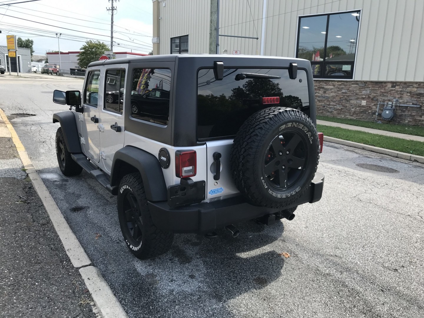 2012 Silver /Black Jeep Wrangler Unlimited Sport 4WD (1C4HJWDG3CL) with an 3.6L V6 DOHC 24V FFV engine, Manual transmission, located at 577 Chester Pike, Prospect Park, PA, 19076, (610) 237-1015, 39.886154, -75.302338 - 2012 Jeep Wrangler Unlimited Sport 4WD: Stick Shift, new PA inspection, SUPER CLEAN, runs LIKE NEW! This vehicle comes inspected and has been given a bumper to bumper safety check. It is very clean, reliable, and well maintained. We offer a unique pay plan that is known for being the easiest and- Photo#6