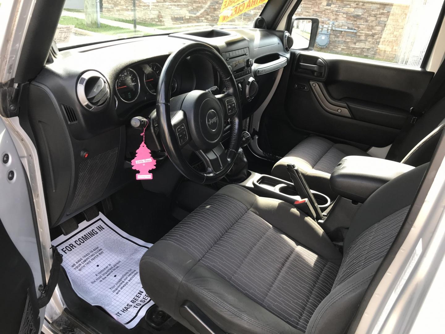 2012 Silver /Black Jeep Wrangler Unlimited Sport 4WD (1C4HJWDG3CL) with an 3.6L V6 DOHC 24V FFV engine, Manual transmission, located at 577 Chester Pike, Prospect Park, PA, 19076, (610) 237-1015, 39.886154, -75.302338 - 2012 Jeep Wrangler Unlimited Sport 4WD: Stick Shift, new PA inspection, SUPER CLEAN, runs LIKE NEW! This vehicle comes inspected and has been given a bumper to bumper safety check. It is very clean, reliable, and well maintained. We offer a unique pay plan that is known for being the easiest and- Photo#9