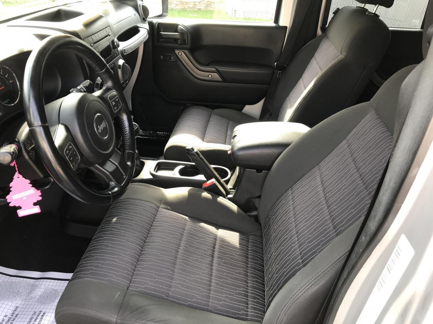 2012 Silver /Black Jeep Wrangler Unlimited Sport 4WD (1C4HJWDG3CL) with an 3.6L V6 DOHC 24V FFV engine, Manual transmission, located at 577 Chester Pike, Prospect Park, PA, 19076, (610) 237-1015, 39.886154, -75.302338 - 2012 Jeep Wrangler Unlimited Sport 4WD: Stick Shift, new PA inspection, SUPER CLEAN, runs LIKE NEW! This vehicle comes inspected and has been given a bumper to bumper safety check. It is very clean, reliable, and well maintained. We offer a unique pay plan that is known for being the easiest and- Photo#11