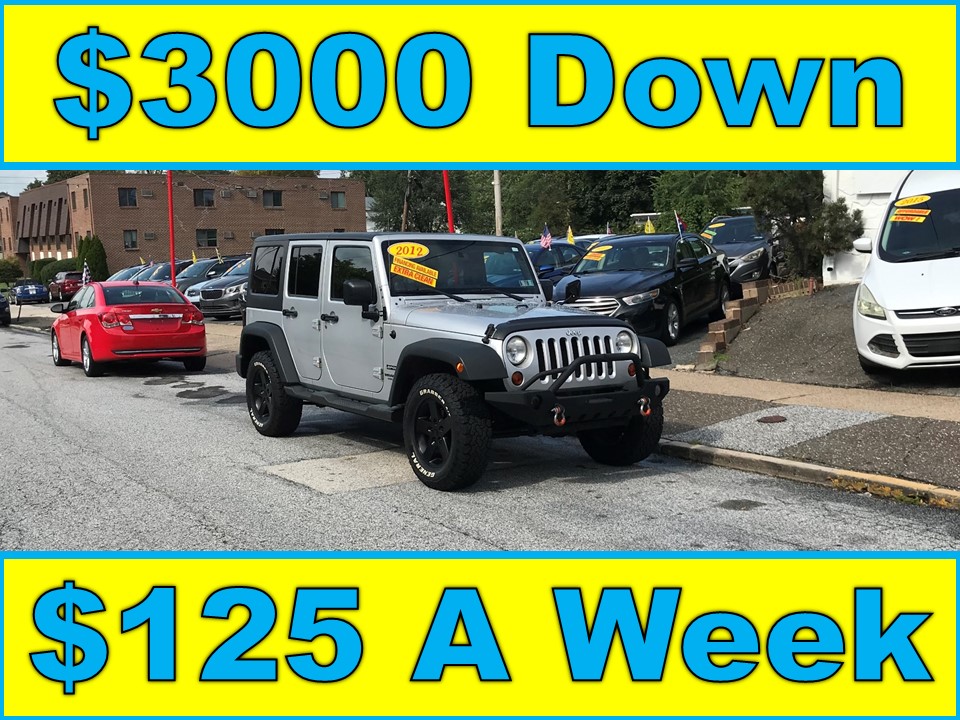 photo of 2012 Jeep Wrangler Unlimited Sport 4WD (Stick Shift)