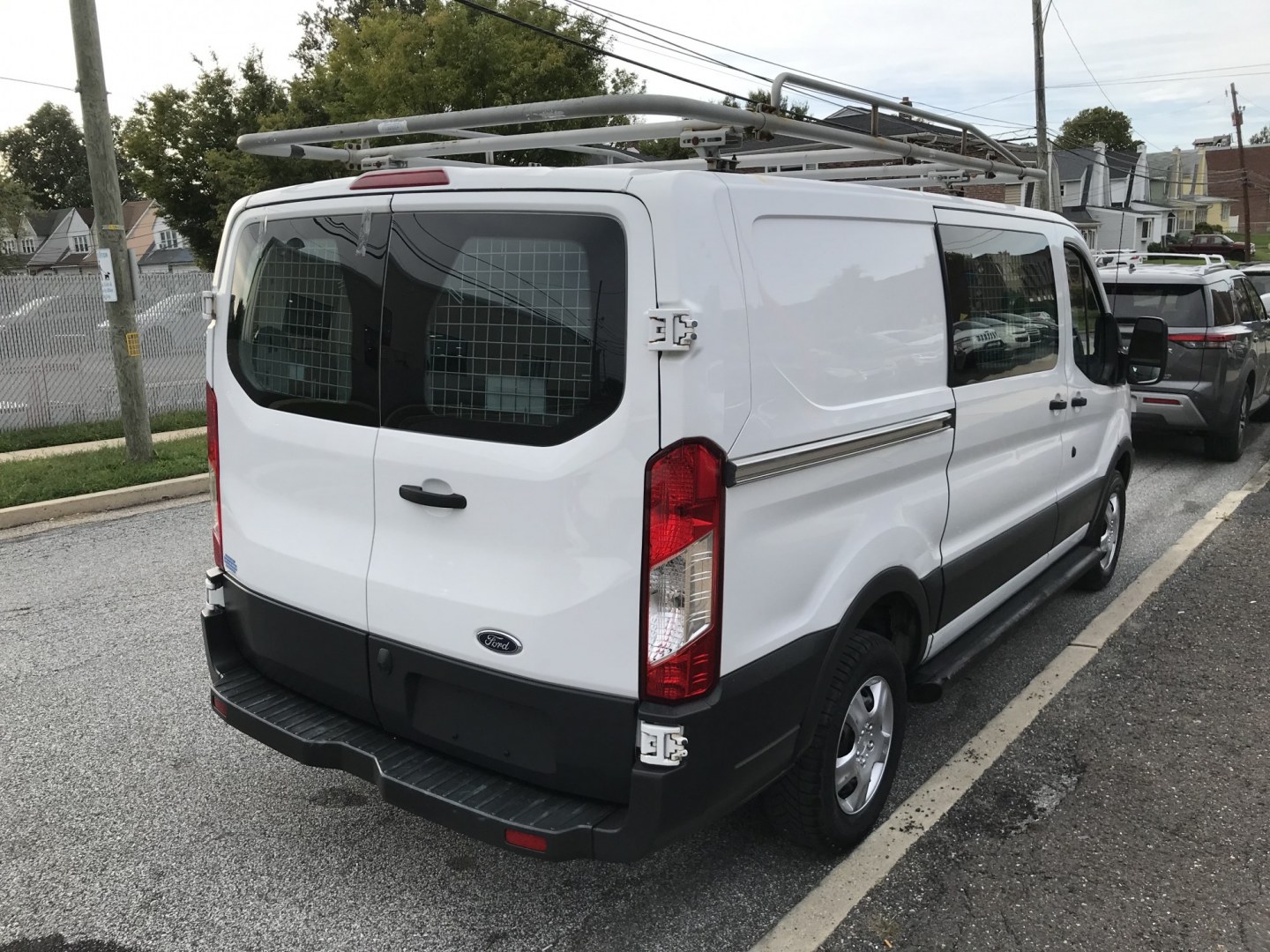 2017 White /Gray Ford Transit 250 Van Low Roof w/Sliding Pass. 130-in. WB (1FTYR1YM8HK) with an 3.7L V6 DOHC 24V engine, 6A transmission, located at 577 Chester Pike, Prospect Park, PA, 19076, (610) 237-1015, 39.886154, -75.302338 - 2017 Ford Transit 250: Ladder racks, shelving, new PA inspection, backup camera, FLEET MAINTAINED! This vehicle comes inspected and has been given a bumper to bumper safety check. It is very clean, reliable, and well maintained. We offer a unique pay plan that is known for being the easiest and f- Photo#4