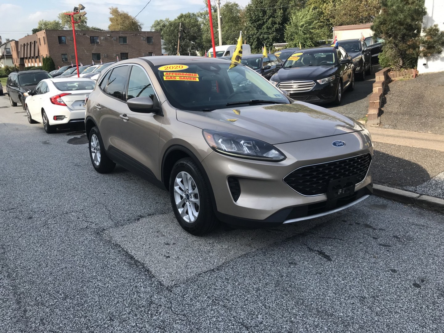 2020 Gold /Tan Ford Escape SE AWD (1FMCU9G65LU) with an 1.5L L3 engine, 6A transmission, located at 577 Chester Pike, Prospect Park, PA, 19076, (610) 237-1015, 39.886154, -75.302338 - 2020 Ford Escape SE: Backup camera, AWD, new PA inspection, SUPER CLEAN, runs LIKE NEW! This vehicle comes inspected and has been given a bumper to bumper safety check. It is very clean, reliable, and well maintained. We offer a unique pay plan that is known for being the easiest and fastest fina- Photo#2
