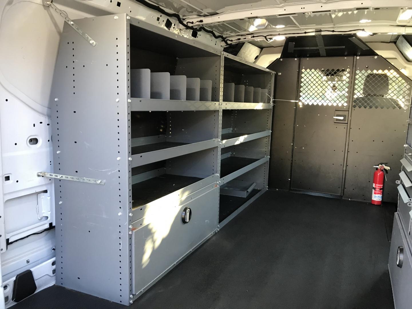 2019 White /Gray Ford Transit 150 Van Low Roof w/Sliding Pass. 130-in. WB (1FTYE1YM2KK) with an 3.7L V6 DOHC 24V engine, 6A transmission, located at 577 Chester Pike, Prospect Park, PA, 19076, (610) 237-1015, 39.886154, -75.302338 - 2019 Ford Transit 150: Multiple pieces of shelving, backup camera, partition, new PA inspection, runs LIKE NEW! This vehicle comes inspected and has been given a bumper to bumper safety check. It is very clean, reliable, and well maintained. We offer a unique pay plan that is known for being the- Photo#15